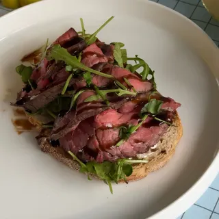 Bruschetta with Cream Cheese, Arugula, and Sun-Dried Tomatoes